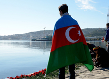 Baku residents bringing flowers to Seaside Boulevard to honor missing oil workers.  Azerbaijan, Dec.07, 2015